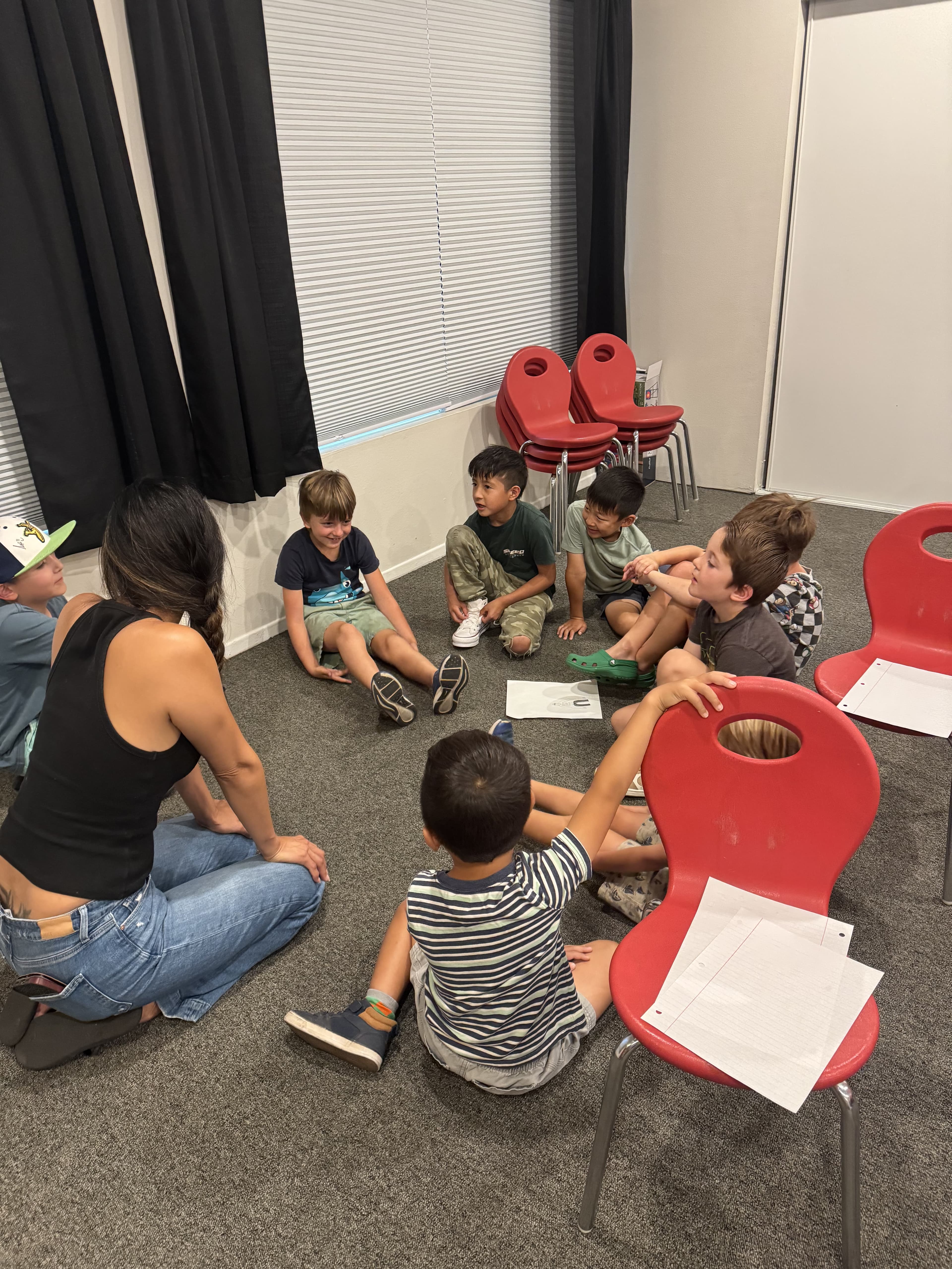 Students working through a speaking activity in a circle