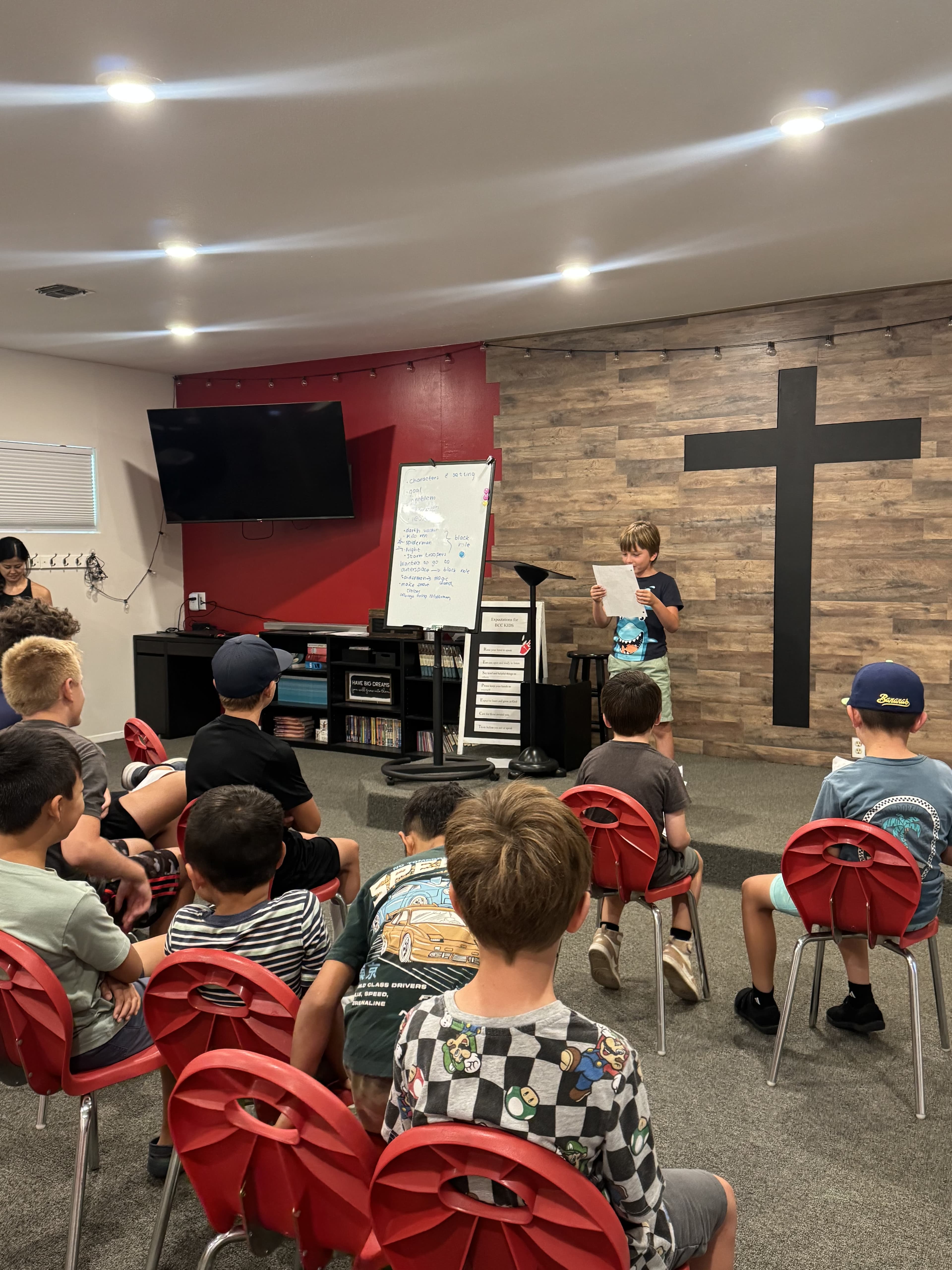 A student presenting to their youth group during a Junior Speakers workshop